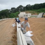 This is the roadside gutter, the road isn't there yet. The sand that has collected here is very fine. Oh, and we had to wear hard hats per site rules.