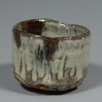 Madaragaratsu guinomi (small cup) with ame glaze accents. Pinched from a ball on the kickwheel.