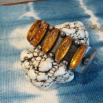 silver/amber bracelet on white turquoise