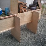 two legs, with low table top acting as stretcher for the high table.