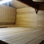 view from the stairs to the storage area behind the curtain.